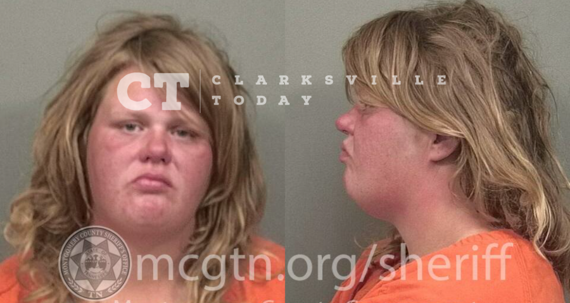 Katie Hawks swings her cane in the air and urinates in front of officers